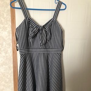 Short striped dress with bow detailing